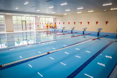 a large swimming pool with blue water at Central Apartment 2 in Sofia