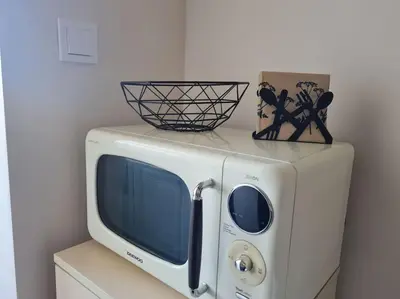 a microwave with a bowl on top of it at Домът на Билкарката in Plovdiv