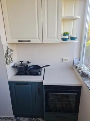 a kitchen with two pots and pans on a stove at Домът на Билкарката in Plovdiv