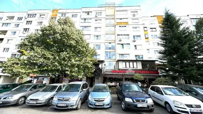 a row of cars parked in front of a building at AGIA- luxury apartment Sofia in Sofia