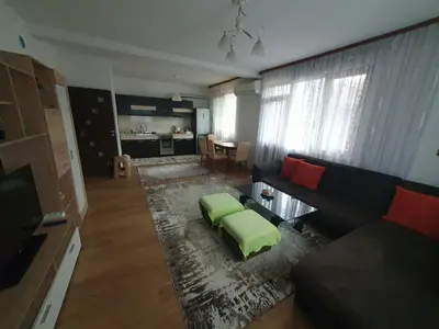 a living room with a couch and a table at Levkov in Petrich