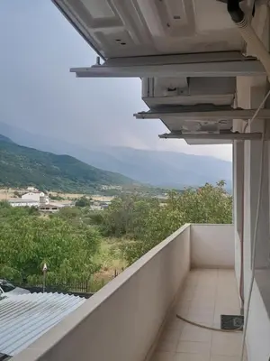 a balcony with a view of the ocean at Levkov in Petrich