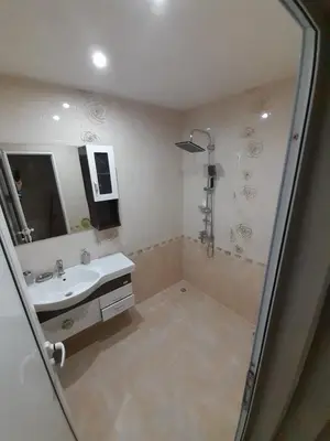 a bathroom with a shower and a sink at Levkov in Petrich