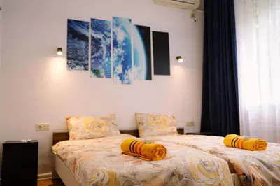 two beds sitting next to each other in a bedroom at 7 Seconds Away From the Main Street, FREE Parking in Sofia