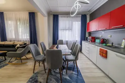 a kitchen and dining room with a table and chairs at 7 Seconds Away From the Main Street, FREE Parking in Sofia