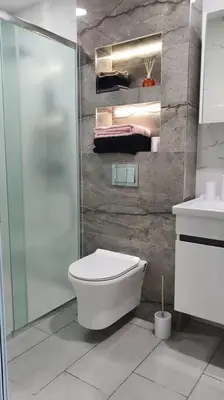 a bathroom with a toilet and a shower and a sink at Panorama view apartment in Gotse Delchev