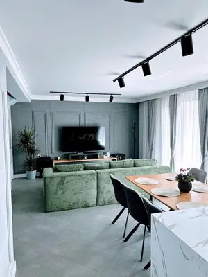 a living room with a couch and a table at Къща за гости Алегра in Garmen