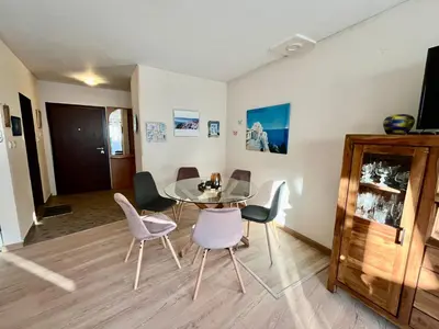 a dining room with a table and chairs at Вила Динати in Perushtitsa