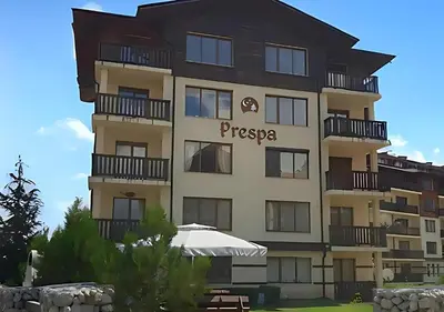 a tall building with a sign on it at Mountain View Apartment with Balcony & Ski Access nearby - Serendipity in Bansko