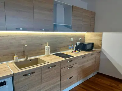 a kitchen with a sink and a microwave at Grace Appartament in Plovdiv