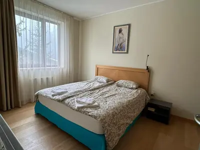 a bedroom with a bed and a window at Silent retreat at Euphoria Club and SPA Borovets in Borovets