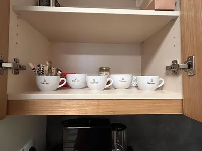 a row of cups sitting on a shelf at Silent retreat at Euphoria Club and SPA Borovets in Borovets