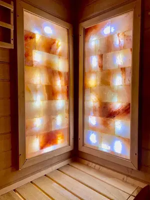 a room with two windows in a wooden house at Hotel Mursal in Yagodina