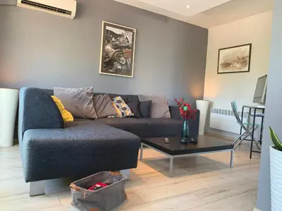 a living room with a couch and a coffee table at Bellevue Appart Centrum in Plovdiv