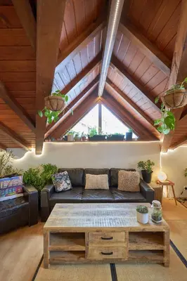 a living room with a couch and a coffee table at Panoramic 2 Bedroom Cabin Retreat Japanese Style in Bansko