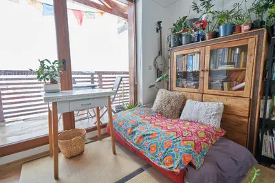 a room with a bed and a table and a desk at Panoramic 2 Bedroom Cabin Retreat Japanese Style in Bansko