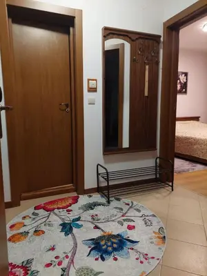 a room with a door and a rug on the floor at Bansko Pirin Golf & Country Club Blue Mountains View in Razlog
