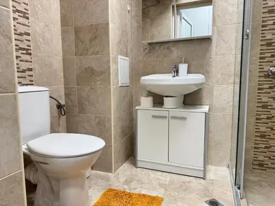 a bathroom with a toilet and a sink at Studio 108 by COSHER in Sofia