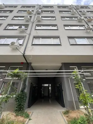 a large apartment building with a hallway in front of it at Santorini modern and cosy Apt near UNSS and NSA w WiFi in Sofia