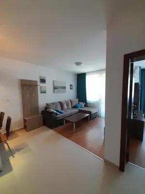 a living room with a couch and a table at Apartments Belvedere B303 in Bansko
