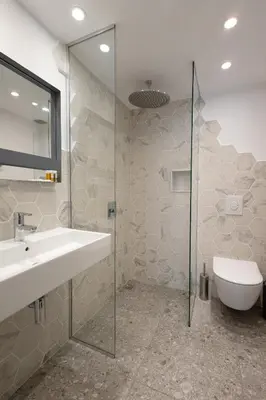 a bathroom with a sink and a glass shower at Luxury studio 12-4 in Plovdiv
