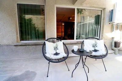 two chairs and a table on a patio at NEW Oasis in the heart of Sofia in Sofia