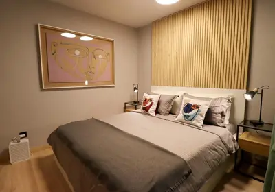 a bedroom with a large bed with pillows on it at NEW Oasis in the heart of Sofia in Sofia