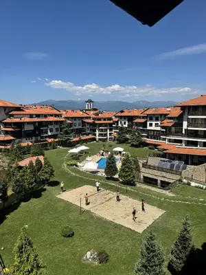 a group of people in a park with a pool at Cedar Lodge III - One BDRM Flat B18 in Bansko