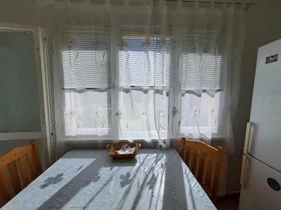 a bedroom with a table and a window with a basket on it at LevskiG Studio 10 min from Sofia Airport and city centre in Sofia