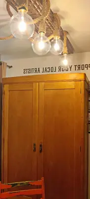 a ceiling fan and a wooden door with a sign on it at Artistic Atelier, Top Center - Vitosha Blvd in Sofia