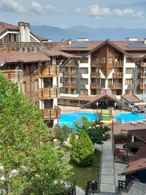 a view of a hotel with two swimming pools at Belvedere Holiday Club H79 in Bansko