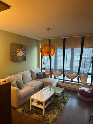 a living room with a couch and a coffee table at Luxury Apartment Bansko in Bansko