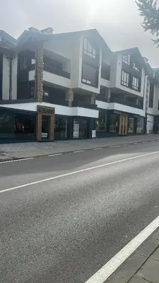 an empty street in front of a building at Luxury Apartment Bansko in Bansko