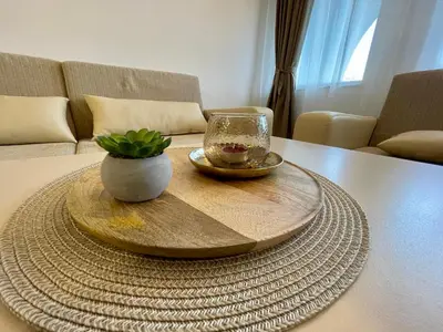 a table with a bowl and a glass on it at GS SKI Apartment - The Grand Monastery Pamporovo in Pamporovo