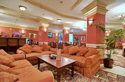 a lobby of a hotel with couches and a table at GS SKI Apartment - The Grand Monastery Pamporovo in Pamporovo