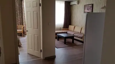 a living room with a couch and a table at Apartments Carrera in Sofia