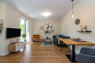 a living room with a couch and a table at Center Apt - Free parking - Walk to Main Street in Plovdiv