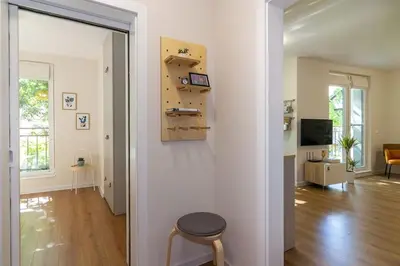 a living room with a table and a stool in a room at Center Apt - Free parking - Walk to Main Street in Plovdiv