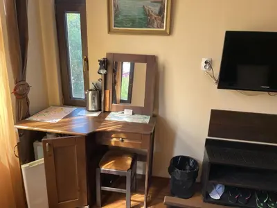 a wooden desk in a room with a mirror at Kapana Plovdiv in Plovdiv