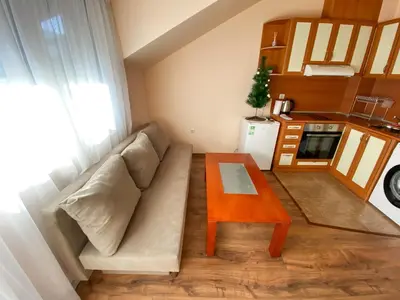 a small living room with a couch and a table at 