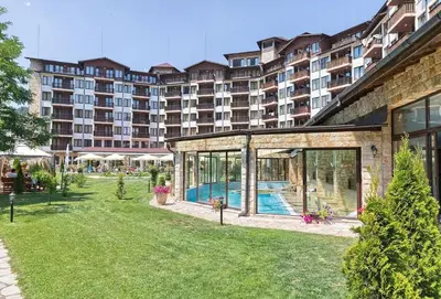 a large apartment building with a swimming pool in a yard at Apartment in Hotel Sveti Spas 5 Velingrad in Velingrad