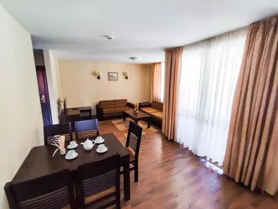 a dining room with a table and chairs at Dream 1BRoom Private Apartment in Bansko