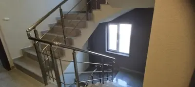a stairway with a window and a stair railing at O pulse Sofia apartment in Sofia