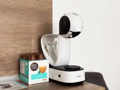 a white mixer sitting on a table next to a box at Large 2-BR Retreat, Walk to Sofias Top Spots in Sofia