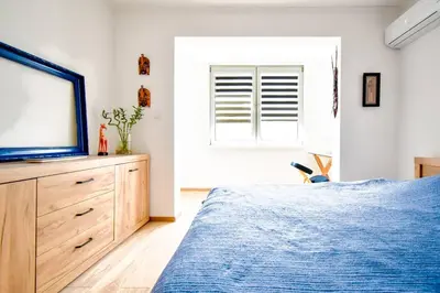 a bedroom with a bed and a tv on a dresser at Work Friendly 2BR AC Terrace Str Parking in Sofia
