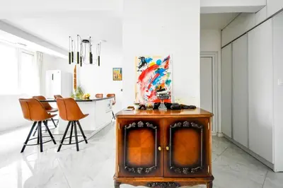 a kitchen with a wood stove and a dining room at 1BDR Quiet Str Vitoshka Area AC in Sofia