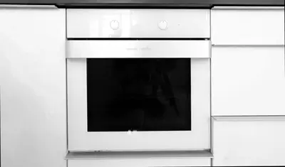 a white stove top oven in a kitchen at 1BDR Quiet Str Vitoshka Area AC in Sofia