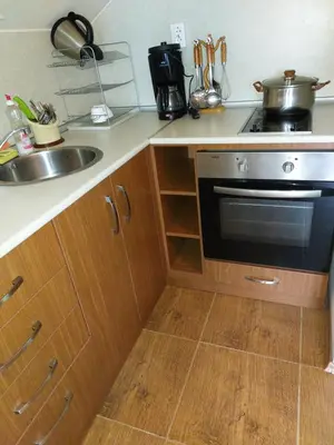 a kitchen with a sink and a stove at Апартамент в Лъки Пампорово комплекс in Pamporovo