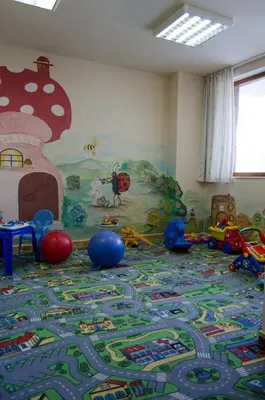 a room with a childs play area with toys on the floor at Апартамент в Лъки Пампорово комплекс in Pamporovo