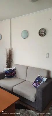 a living room with a gray couch in a room at Gondola area, Cedar Lodge 4, apart D30, Bansko in Bansko